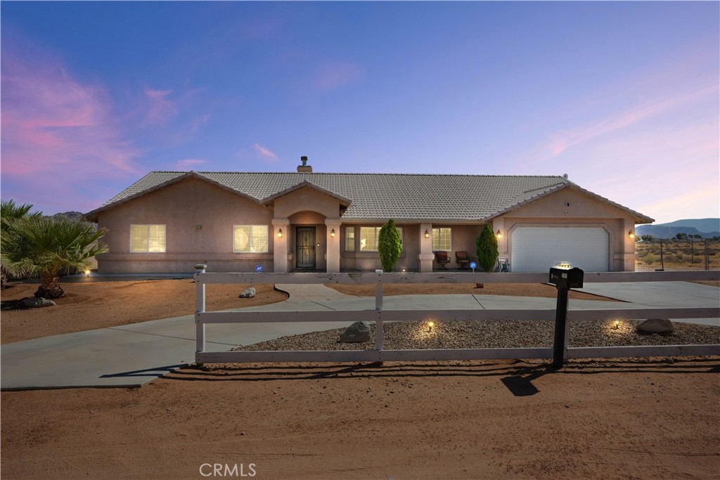 16015 Apache Road Apple Valley, CA 92307 - Photo 1 of 1 a front view of a house with garage