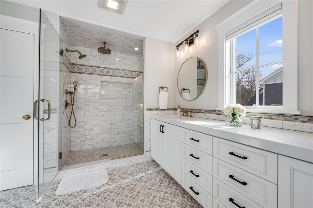 6 Stanwood Point, Unit A Gloucester, MA 01930 - Photo 14 of 25 a bathroom with a granite countertop sink mirror and shower