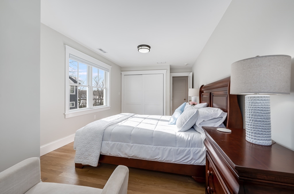 6 Stanwood Point, Unit A Gloucester, MA 01930 - Photo 19 of 25 a bedroom with a bed and window