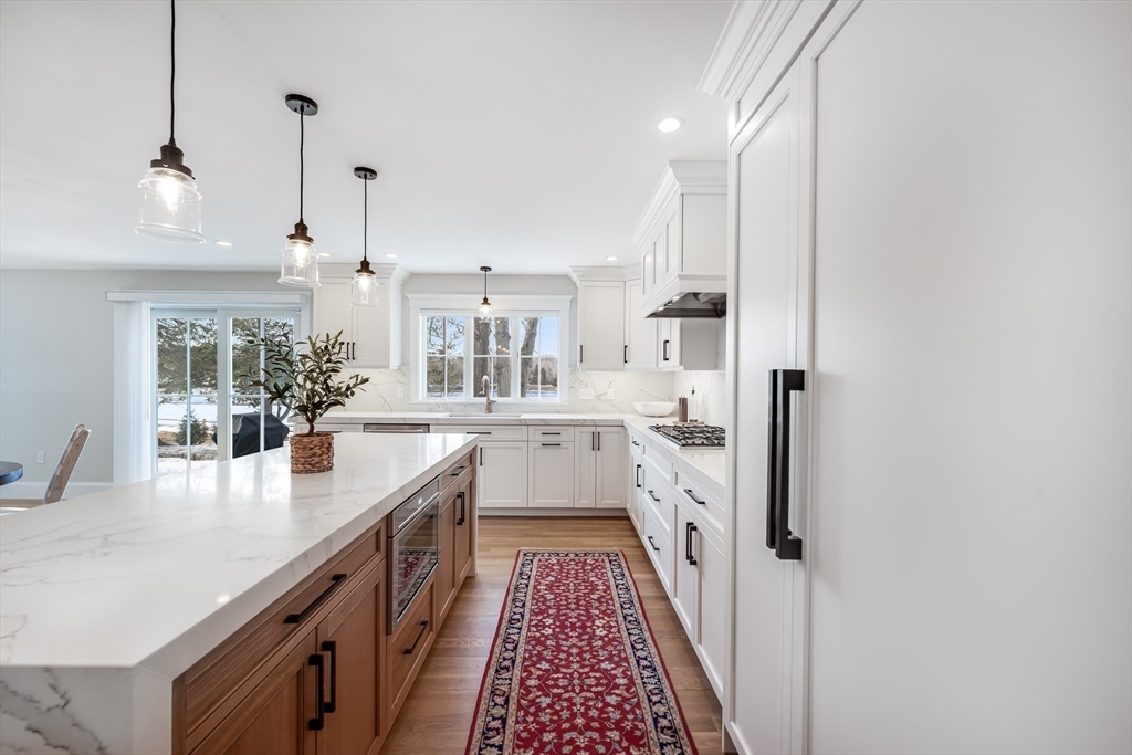 6 Stanwood Point, Unit A Gloucester, MA 01930 - Photo 3 of 25 a large white kitchen with sink and refrigerator
