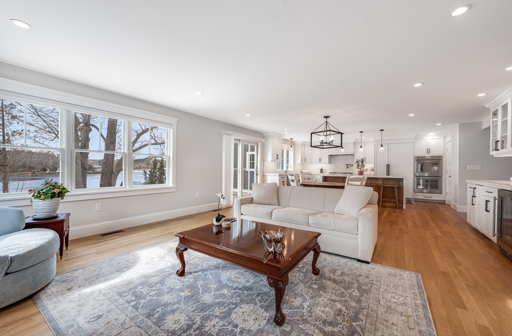 6 Stanwood Point, Unit A Gloucester, MA 01930 - Photo 8 of 25 a living room with furniture a rug and a large window