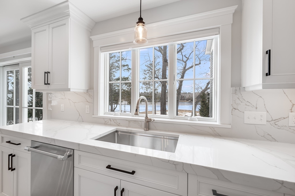 6 Stanwood Point, Unit A Gloucester, MA 01930 - Photo 9 of 25 a view of a kitchen with a sink and cabinets