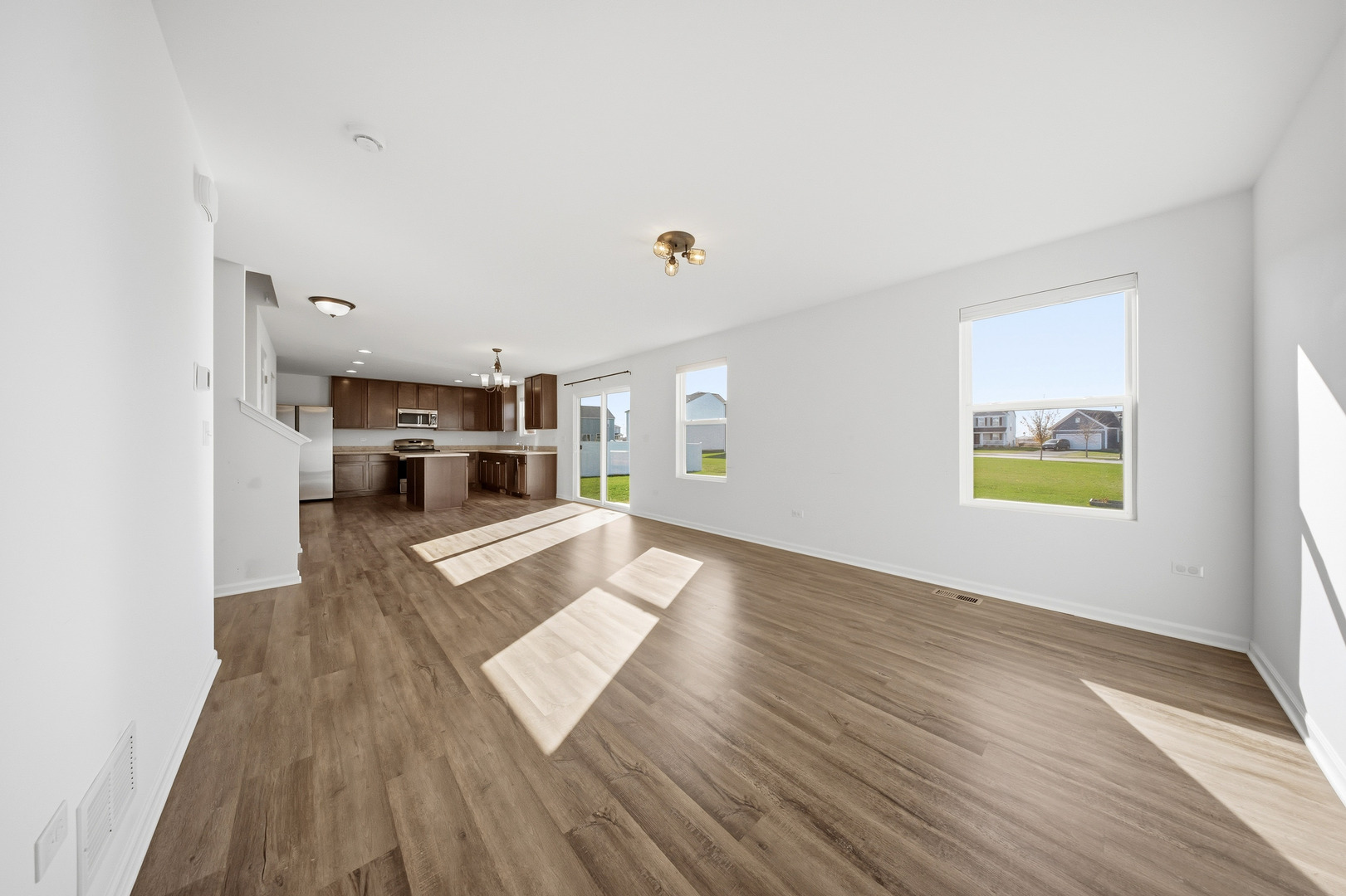 949 Hyte Street Plano, IL 60545 - Photo 11 of 51 a living room with furniture and a wooden floor