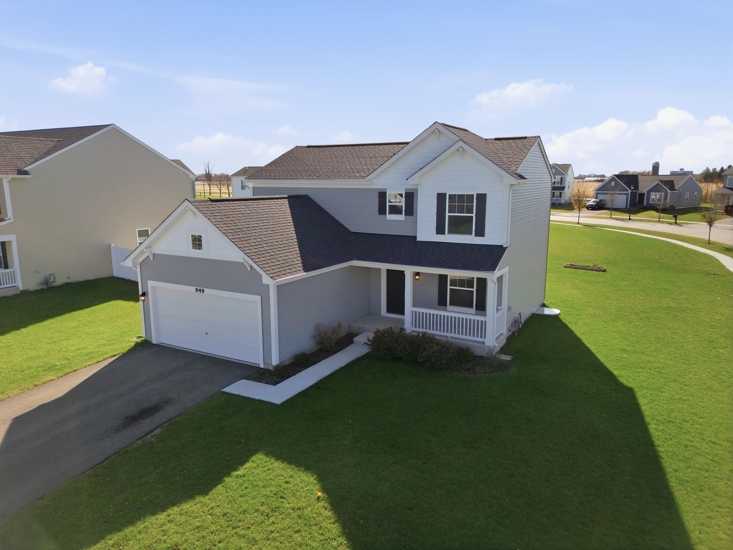 949 Hyte Street Plano, IL 60545 - Photo 37 of 51 a view of a house with a yard
