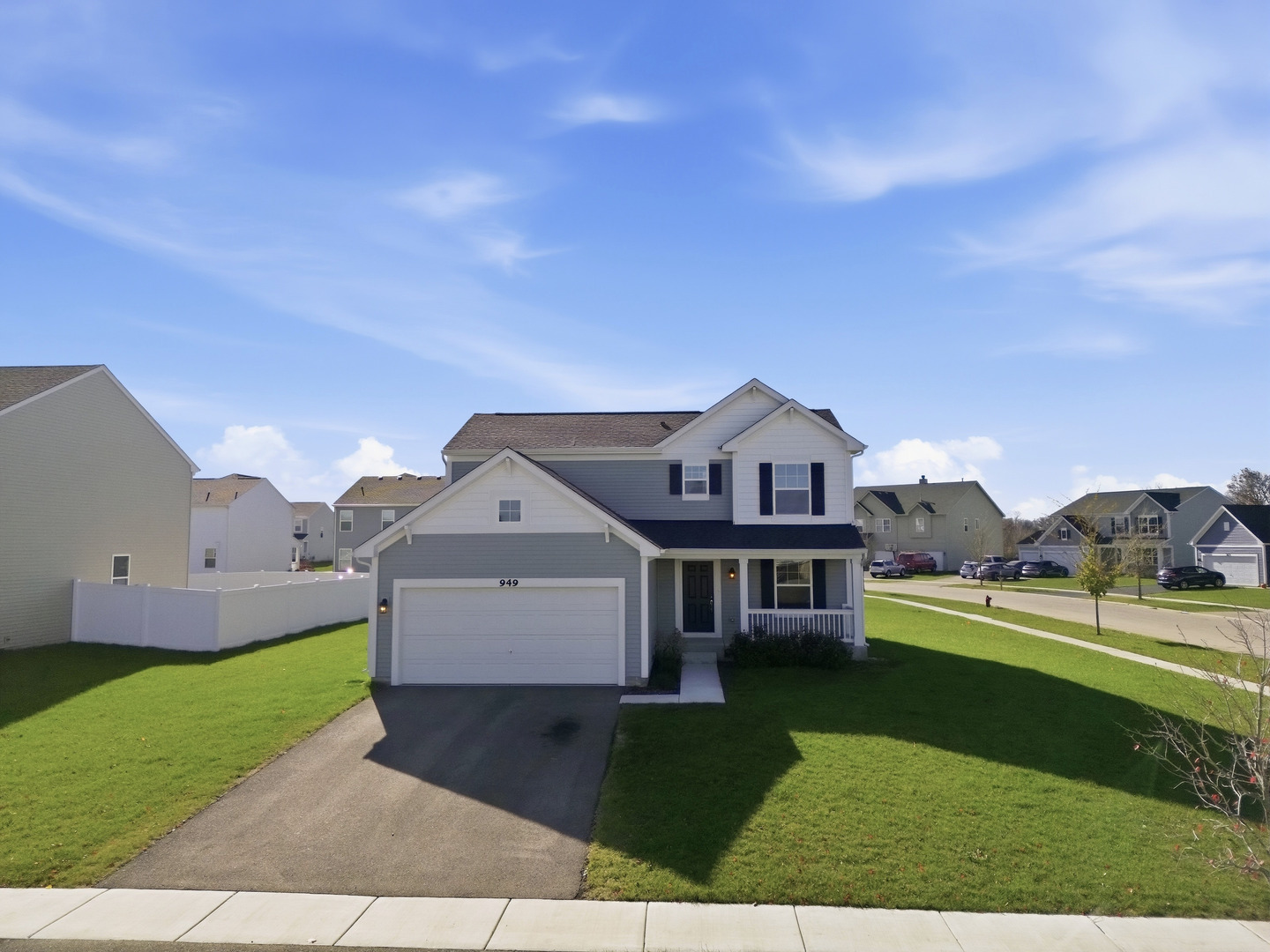 949 Hyte Street Plano, IL 60545 - Photo 39 of 51 a front view of a house with a yard and garage
