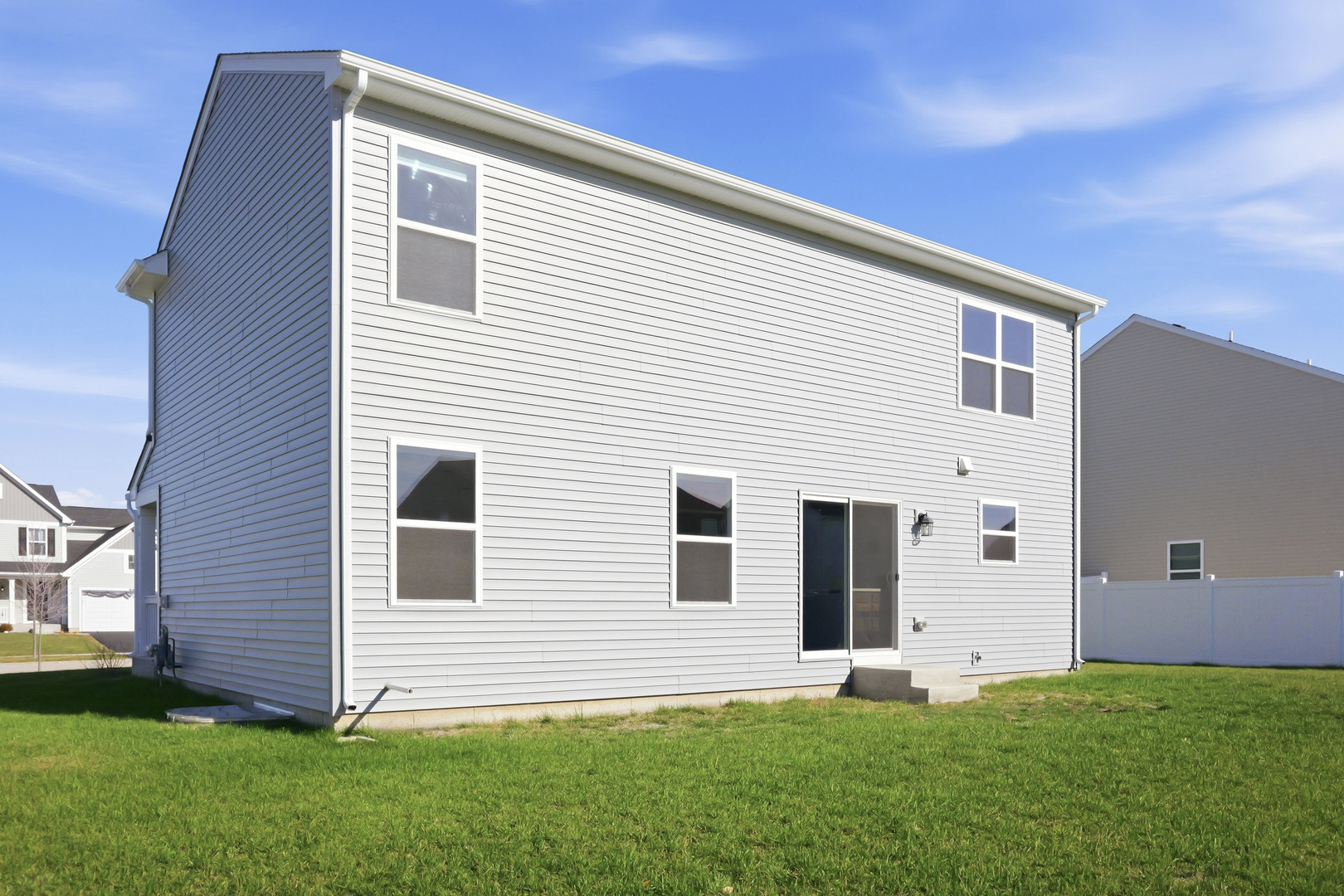 949 Hyte Street Plano, IL 60545 - Photo 41 of 51 a view of a backyard with plants and a large tree