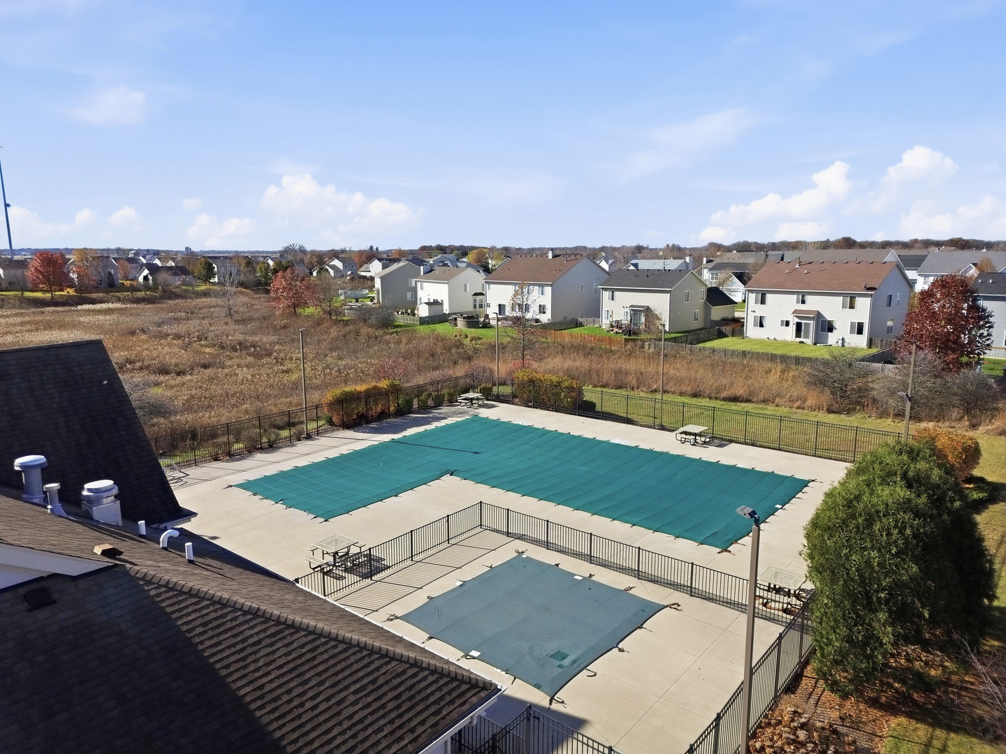 949 Hyte Street Plano, IL 60545 - Photo 46 of 51 a view of a tennis ground with large trees