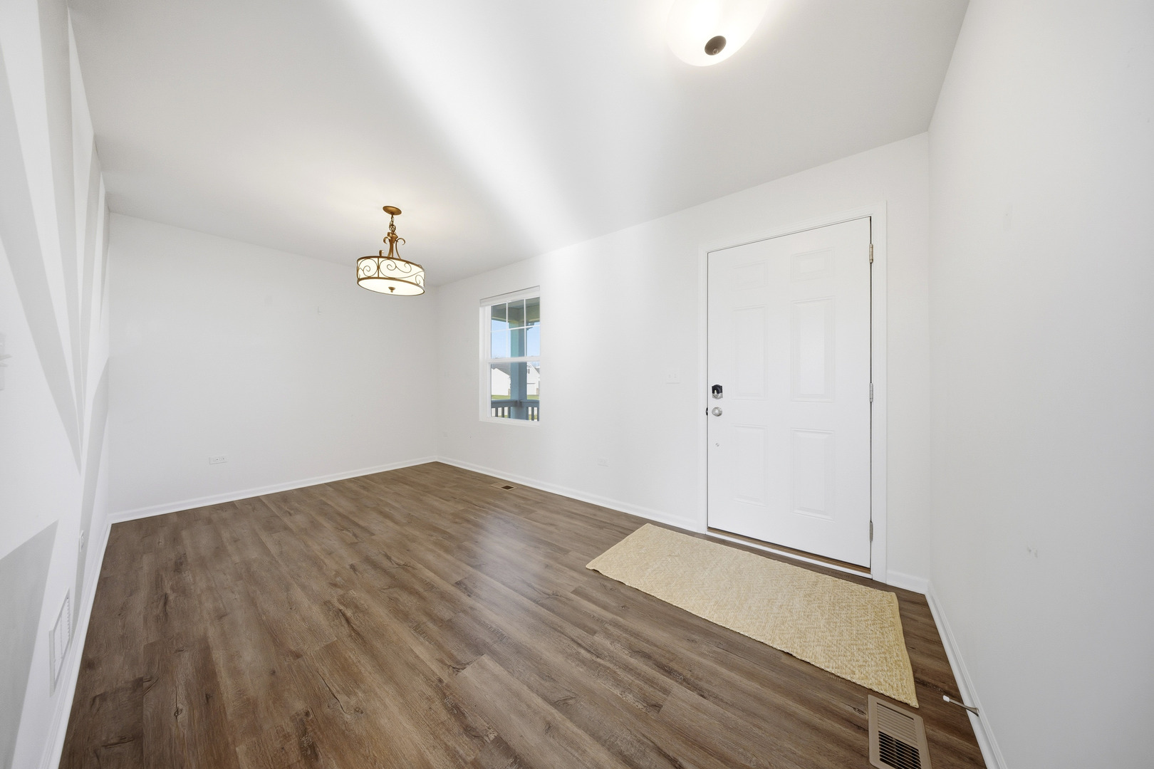 949 Hyte Street Plano, IL 60545 - Photo 5 of 51 a view of an empty room and window