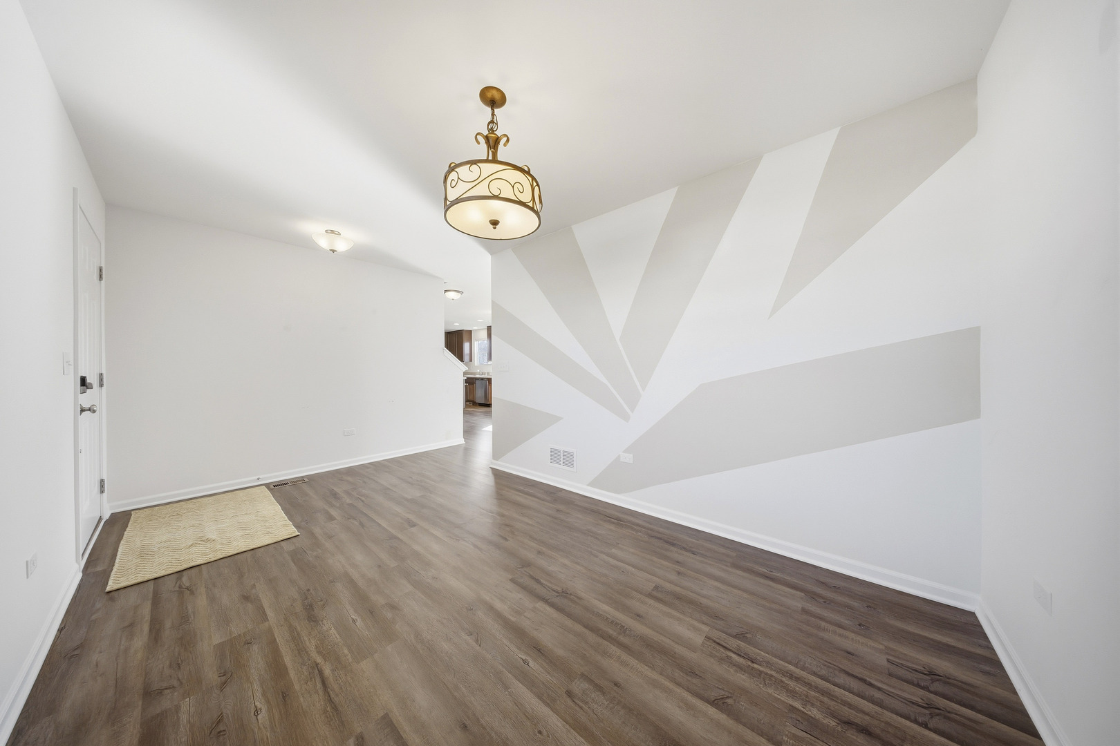 949 Hyte Street Plano, IL 60545 - Photo 7 of 51 an empty room with wooden floor and windows