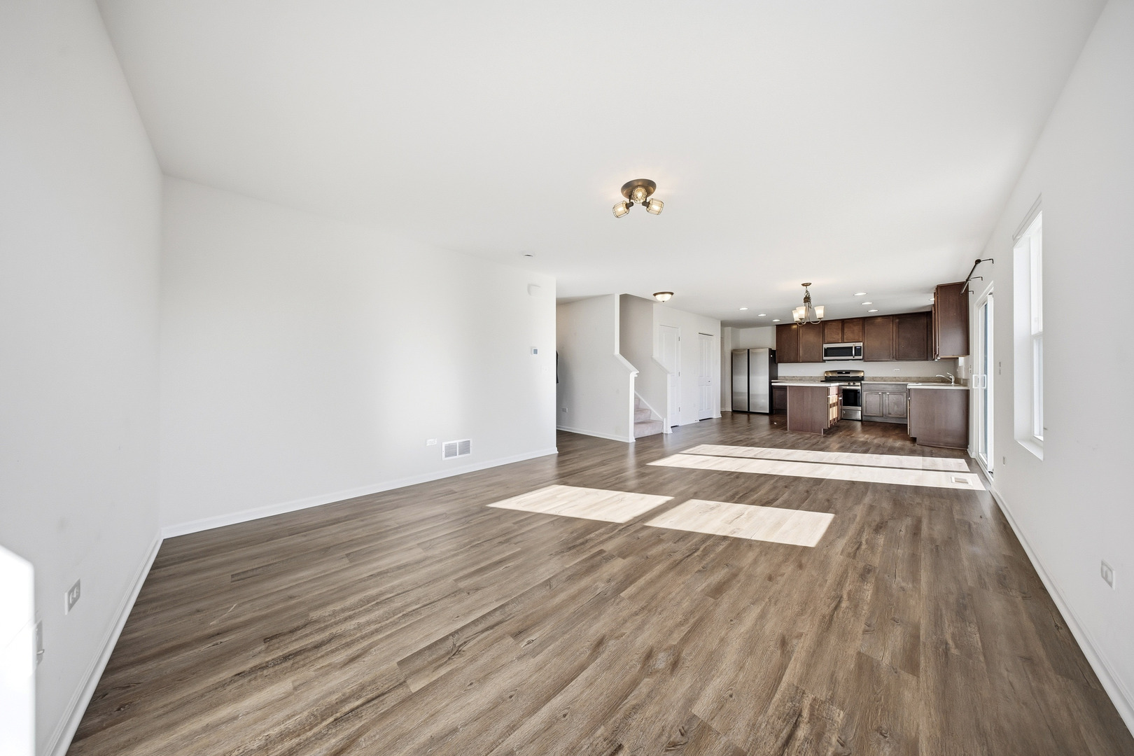 949 Hyte Street Plano, IL 60545 - Photo 9 of 51 a view of empty room with wooden floor