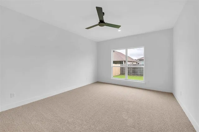 a kitchen that has a sink a stove and a wooden floor