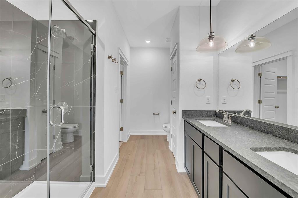 2812 Teasdale Road Lorena, TX 76655 - Photo 5 of 15 a bathroom with a granite countertop sink a shower and a mirror