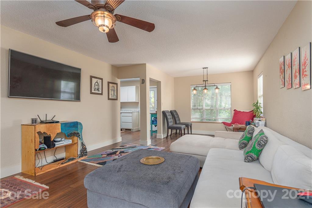 1035 County Road Waynesville, NC 28785 - Photo 2 of 15 a living room with furniture and a flat screen tv