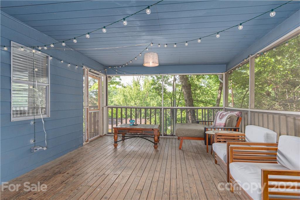 1035 County Road Waynesville, NC 28785 - Photo 14 of 15 a balcony with wooden floor and outdoor space