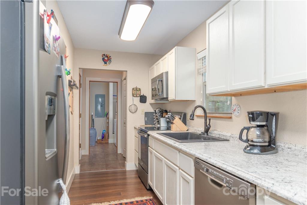 1035 County Road Waynesville, NC 28785 - Photo 4 of 15 a kitchen with sink and cabinets
