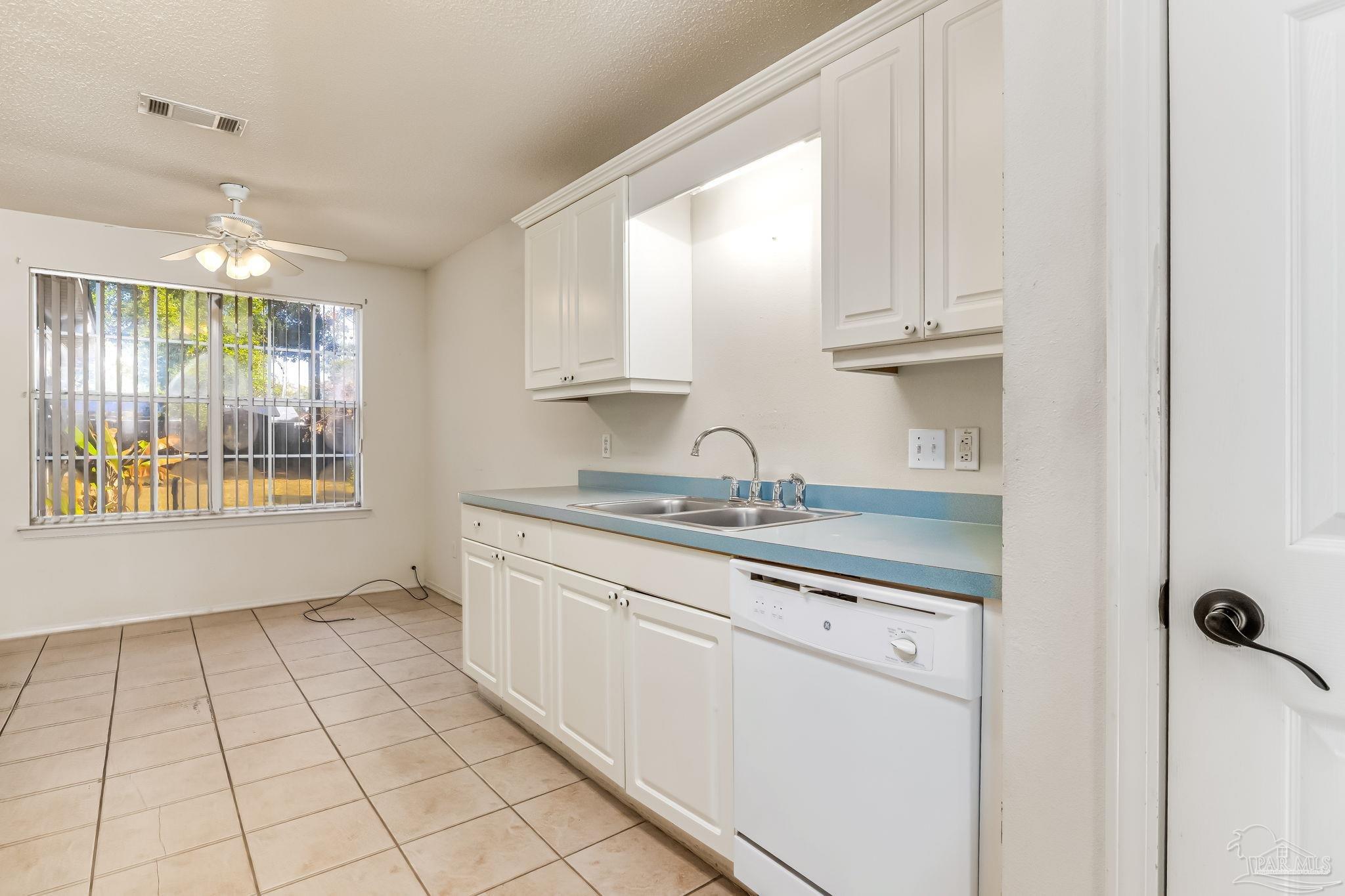 5503 Chantilly Circle Milton, FL 32583 - Photo 9 of 21 a kitchen with granite countertop white cabinets and a sink