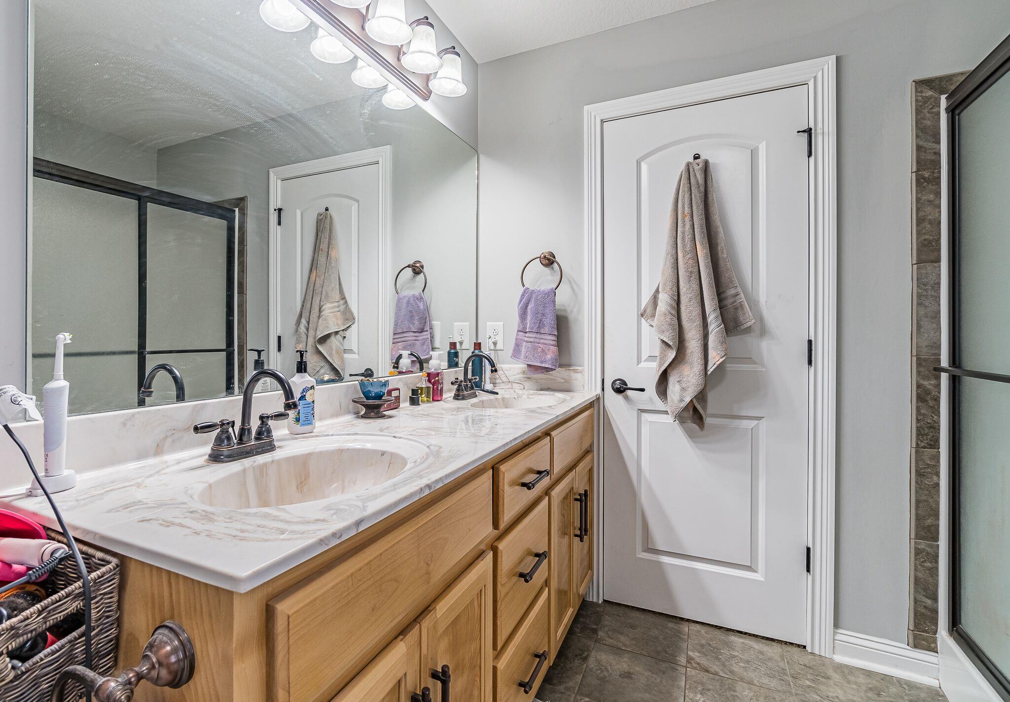 1753 Springhaven Drive Clarksville, TN 37042 - Photo 11 of 18 a bathroom with a sink double vanity and a mirror
