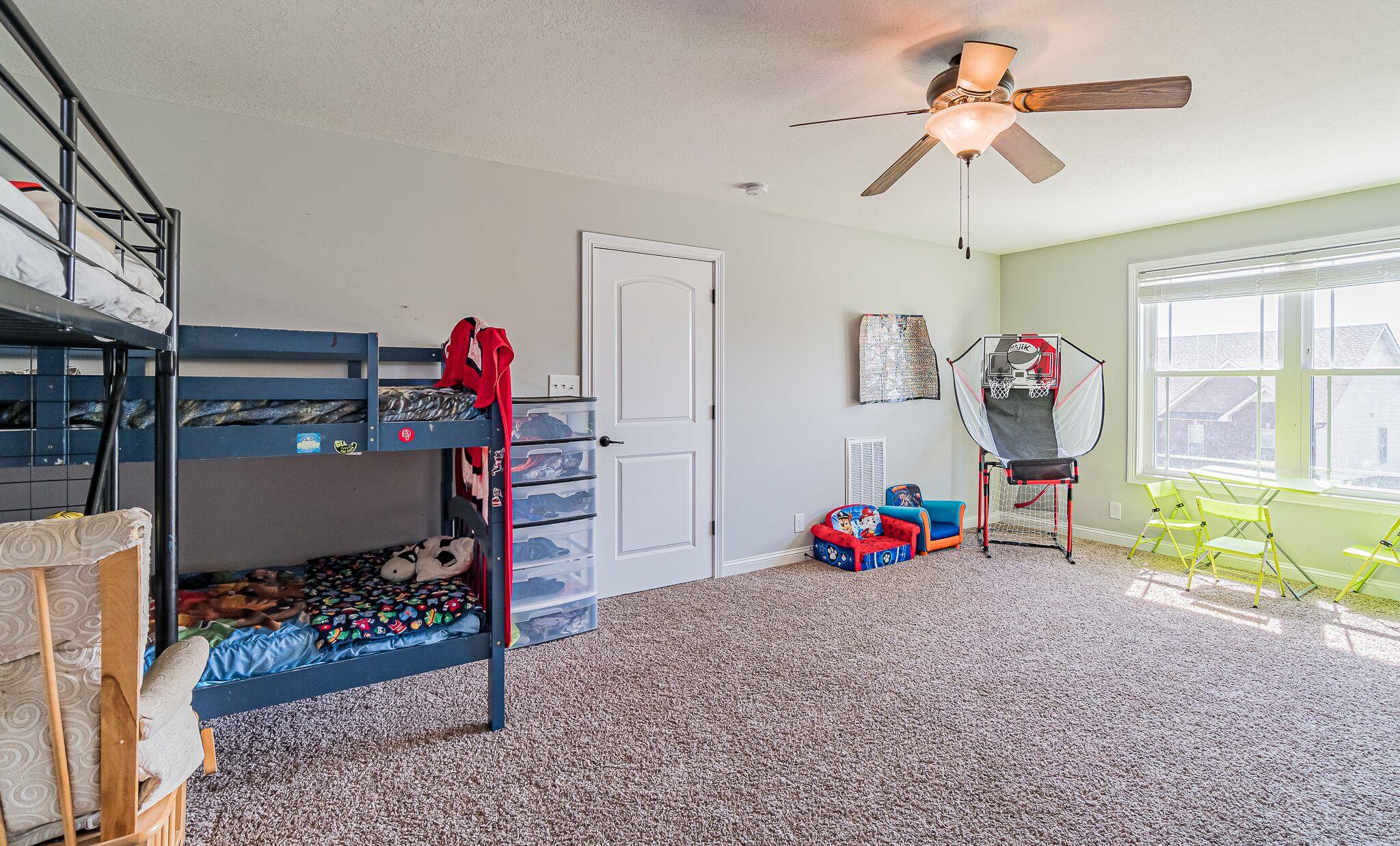 1753 Springhaven Drive Clarksville, TN 37042 - Photo 13 of 18 a bedroom with furniture and a chandelier