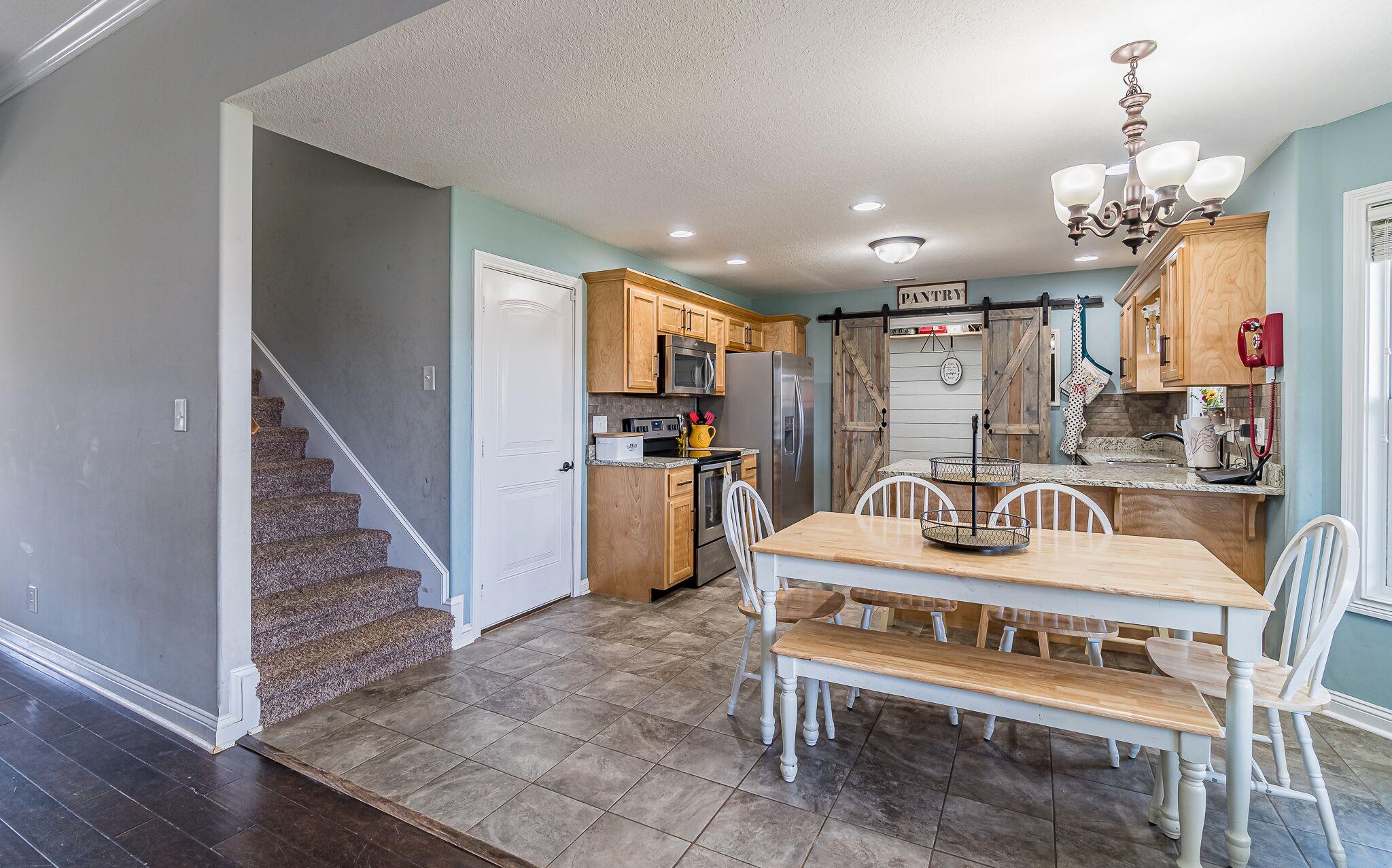 1753 Springhaven Drive Clarksville, TN 37042 - Photo 4 of 18 a large kitchen with a table and chairs