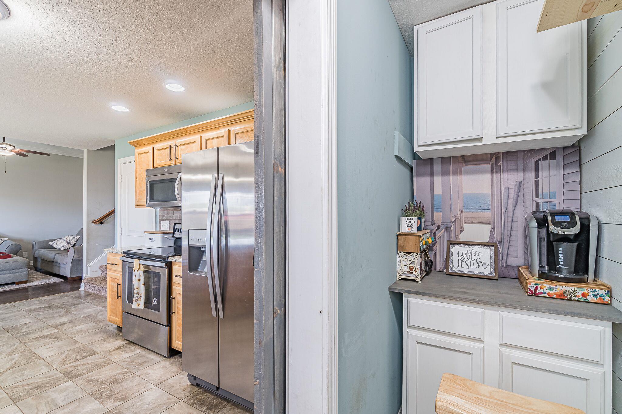 1753 Springhaven Drive Clarksville, TN 37042 - Photo 7 of 18 a kitchen with stainless steel appliances granite countertop a refrigerator and a stove