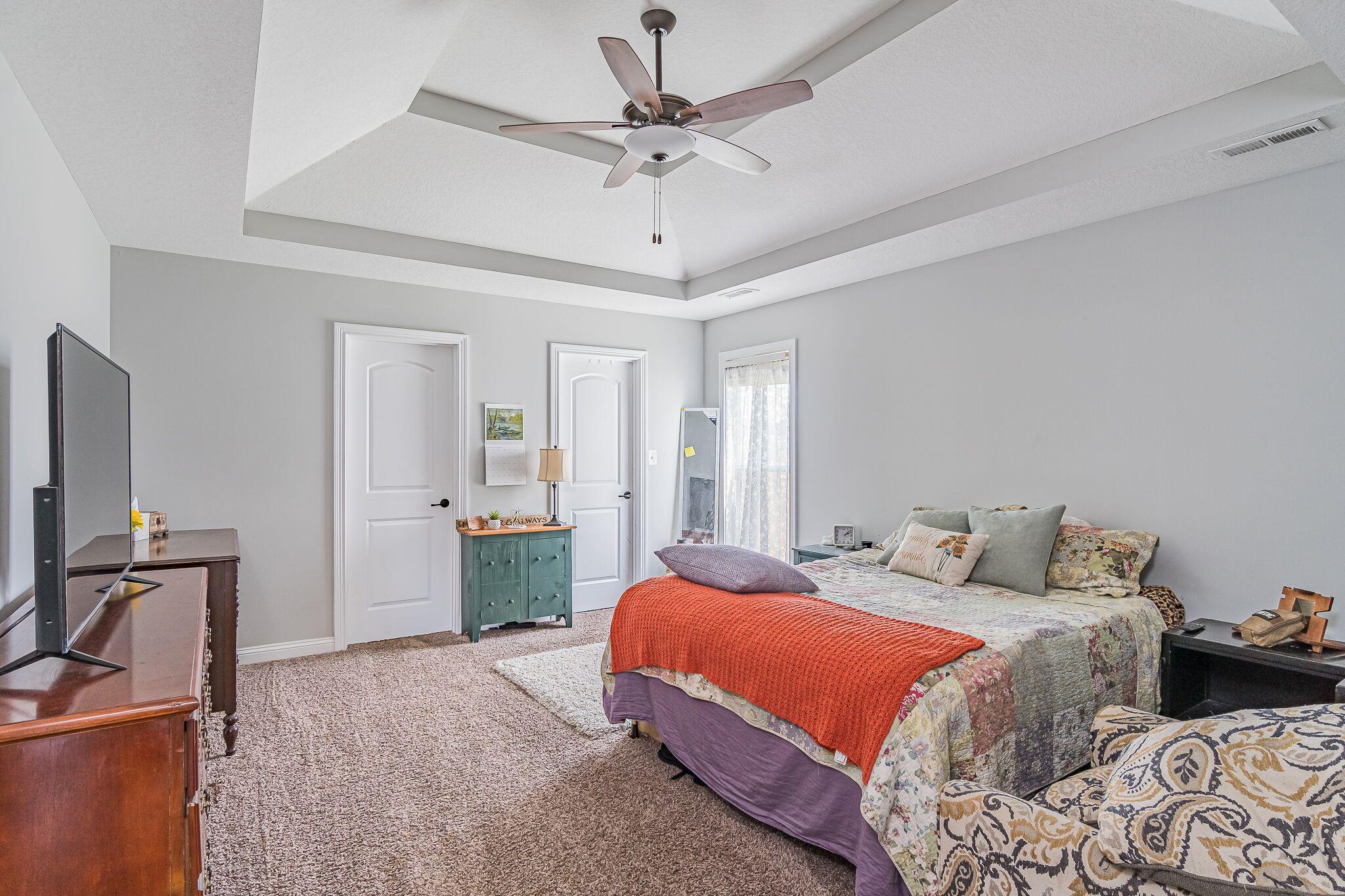 1753 Springhaven Drive Clarksville, TN 37042 - Photo 9 of 18 a bedroom with a bed and a chandelier