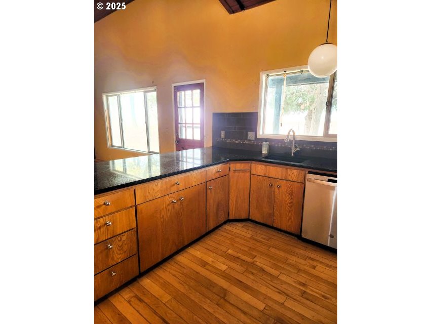 68766 Weatherford Road Arlington, OR 97812 - Photo 13 of 27 a view of a kitchen with a sink and a window
