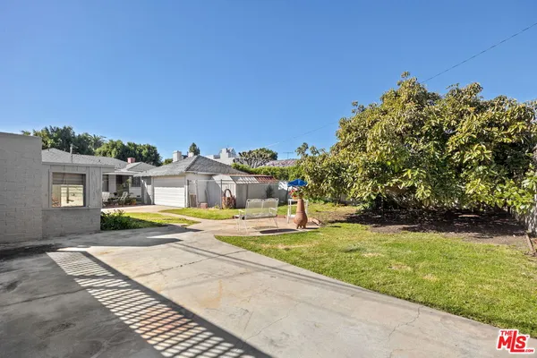 a view of a swimming pool with a yard