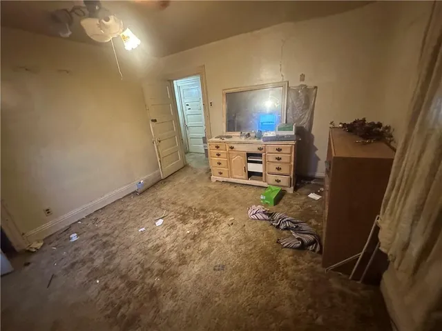 a room with furniture and a flat screen tv