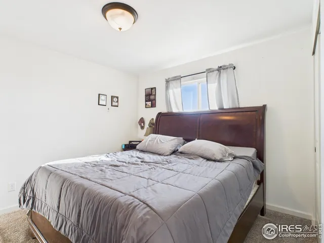 a bathroom with a sink vanity mirror and toilet