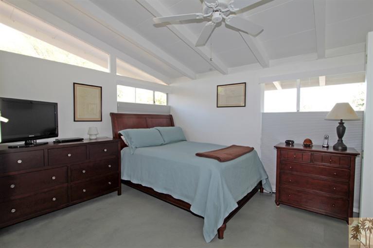 71705 Tunis Road Rancho Mirage, CA 92270 - Photo 15 of 29 a bedroom with a bed and a flat screen tv