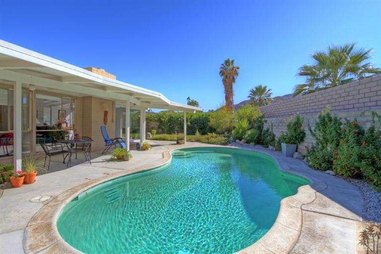 71705 Tunis Road Rancho Mirage, CA 92270 - Photo 3 of 29 a swimming pool with outdoor seating and yard