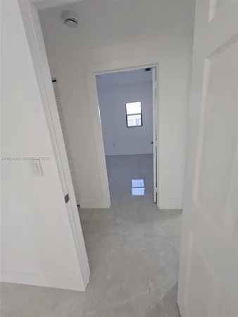 an empty room with a mirror