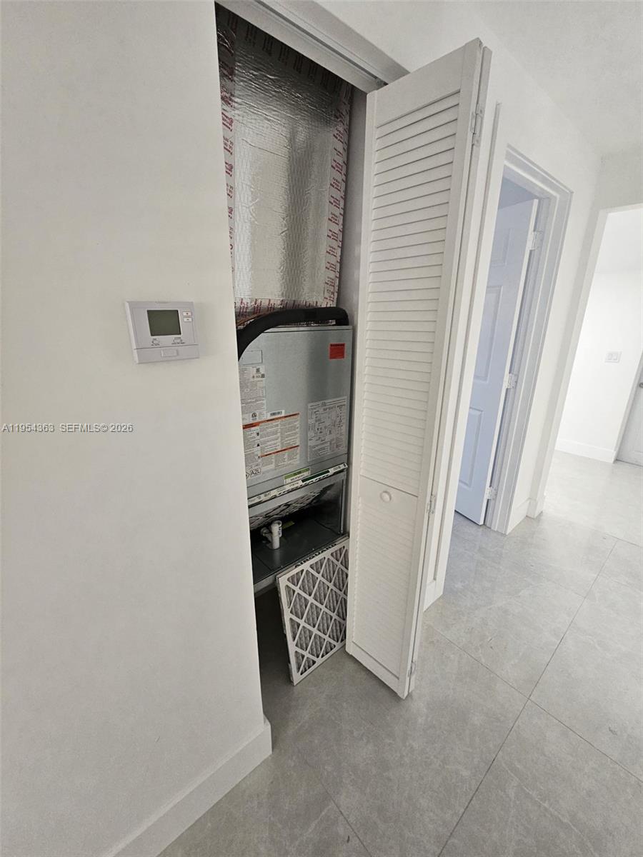 1148 Northwest 100th Street, Unit 1 Miami, FL 33150 - Photo 15 of 32 a view of walk in closet