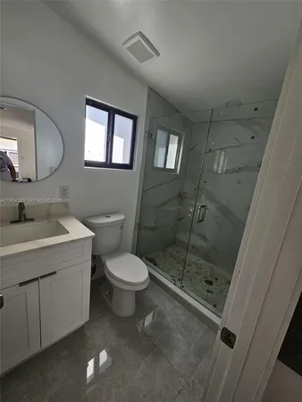 a kitchen with stainless steel appliances a sink stove and cabinets
