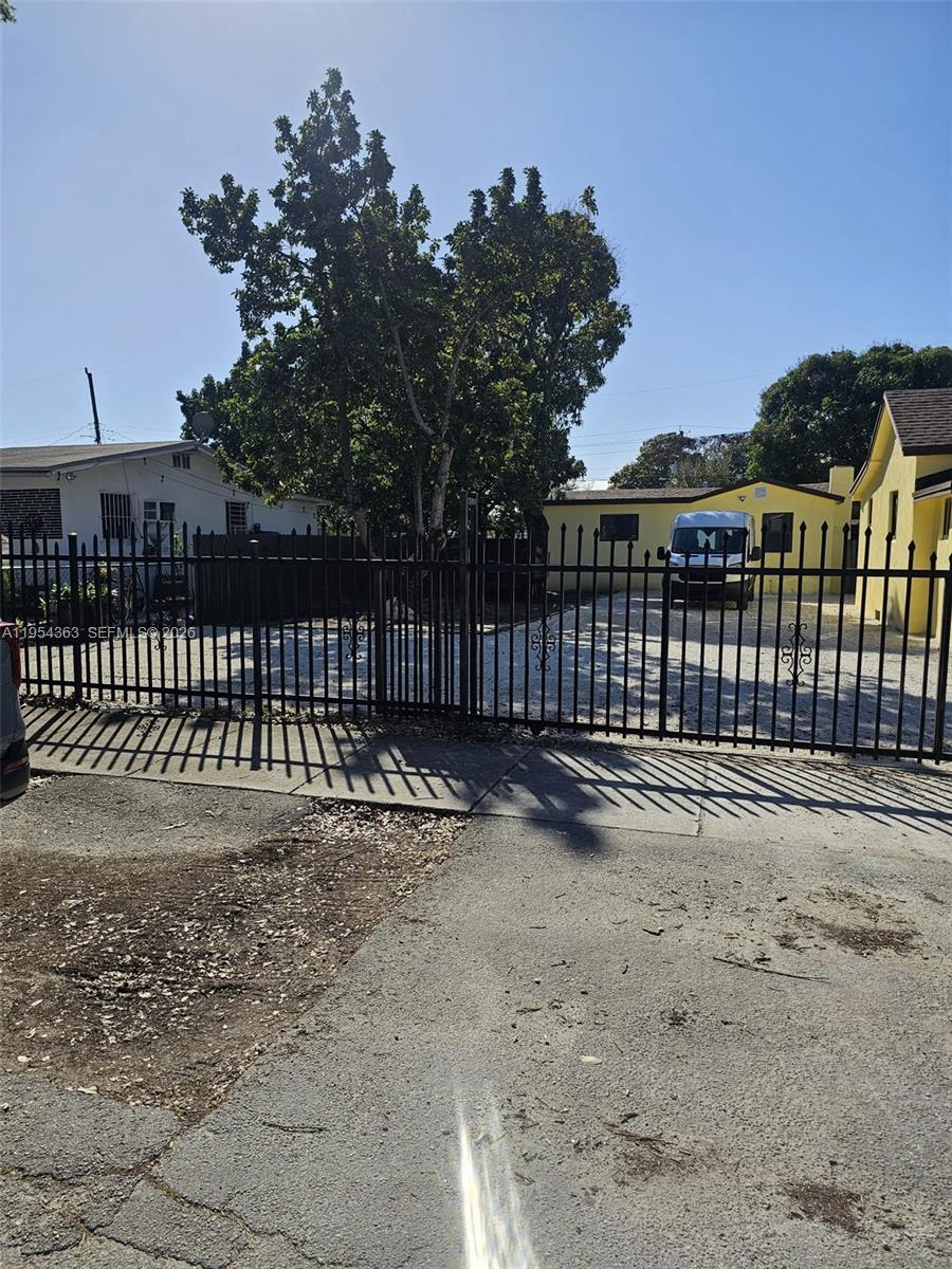 1148 Northwest 100th Street, Unit 1 Miami, FL 33150 - Photo 2 of 32 a view of a backyard with a garden