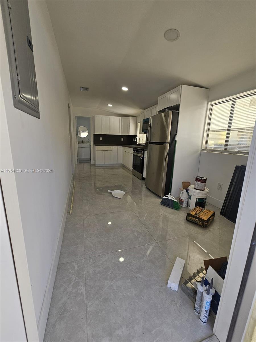 1148 Northwest 100th Street, Unit 1 Miami, FL 33150 - Photo 22 of 32 a view of a room with gym equipment