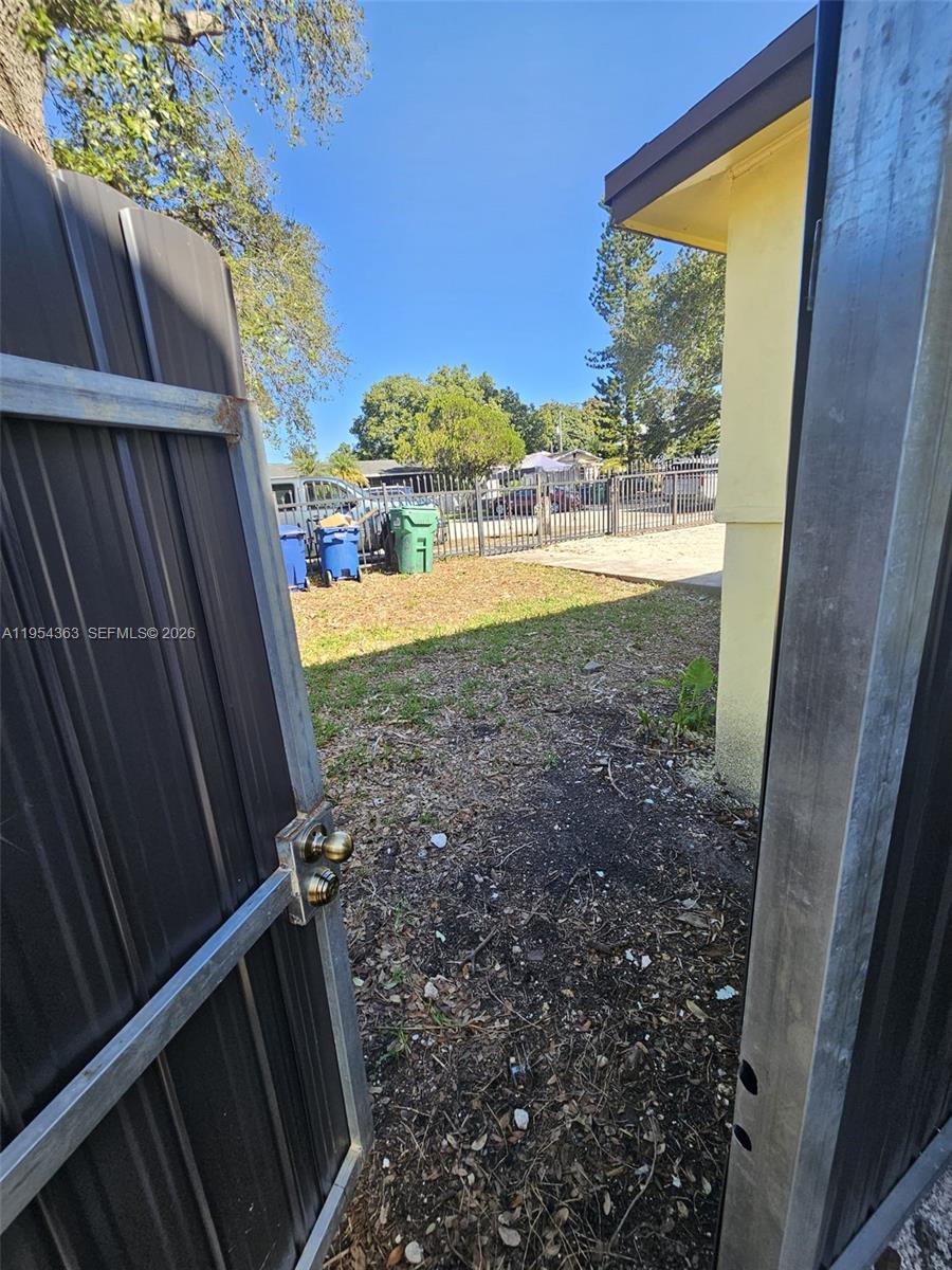 1148 Northwest 100th Street, Unit 1 Miami, FL 33150 - Photo 31 of 32 a view of balcony with wooden floor