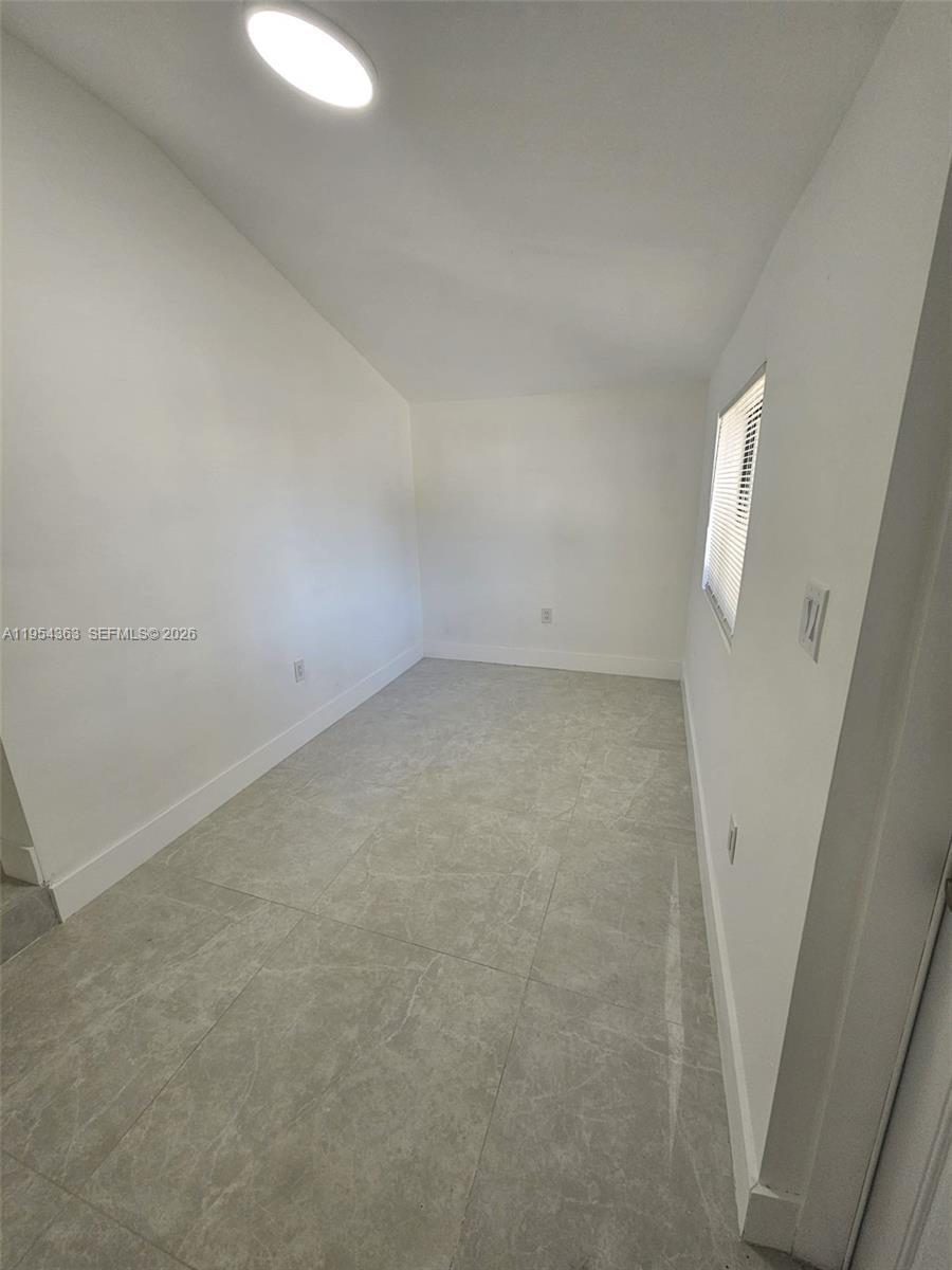 1148 Northwest 100th Street, Unit 1 Miami, FL 33150 - Photo 6 of 32 a view of a small space
