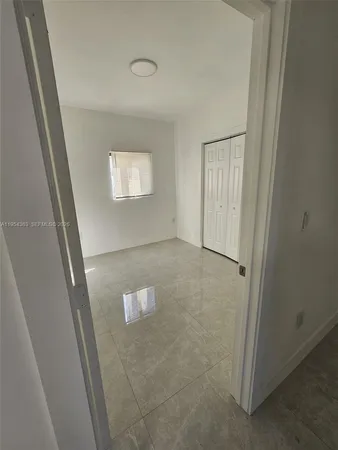 a bathroom with a shower toilet and sink