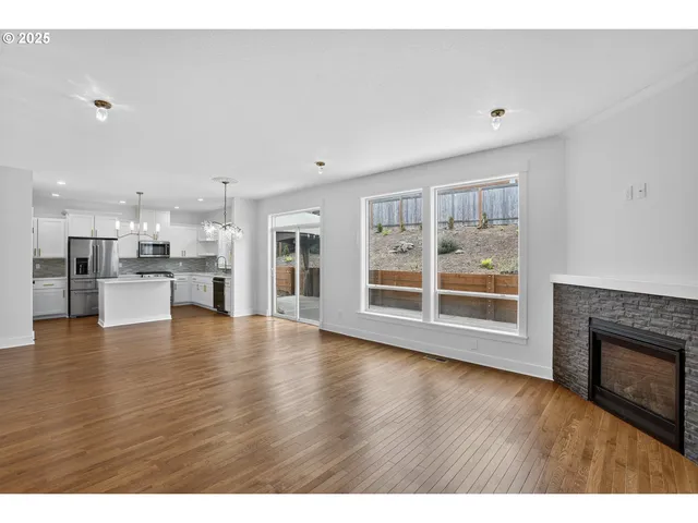 a view of kitchen with furniture and wooden floor