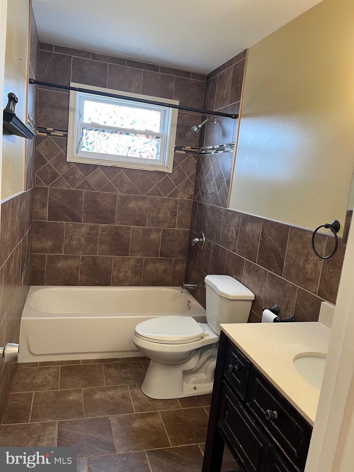 8829 Sigrid Road Randallstown, MD 21133 - Photo 13 of 28 a bathroom with a sink a toilet and bathtub