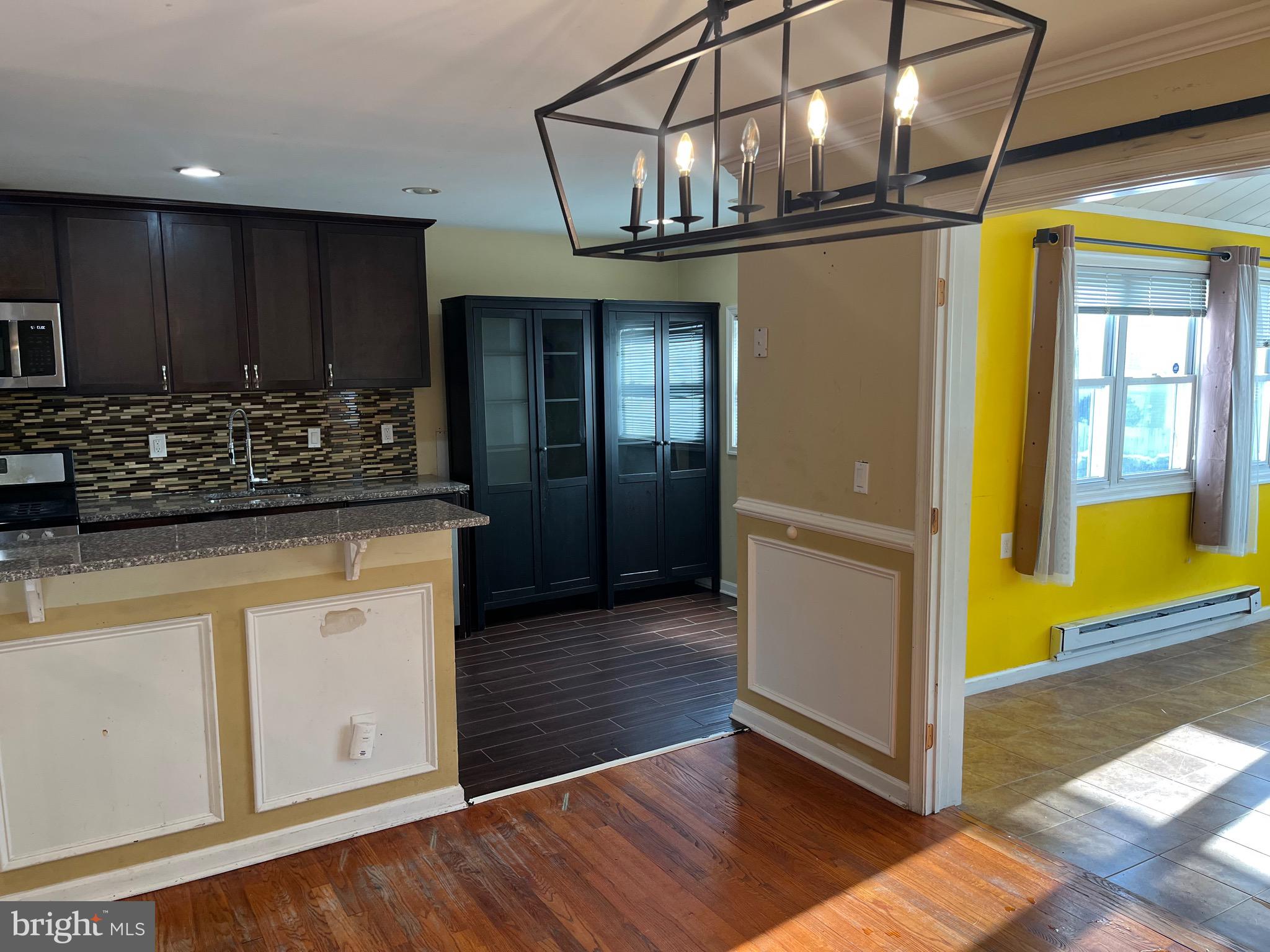 8829 Sigrid Road Randallstown, MD 21133 - Photo 15 of 23 a kitchen with stainless steel appliances granite countertop a refrigerator and a stove