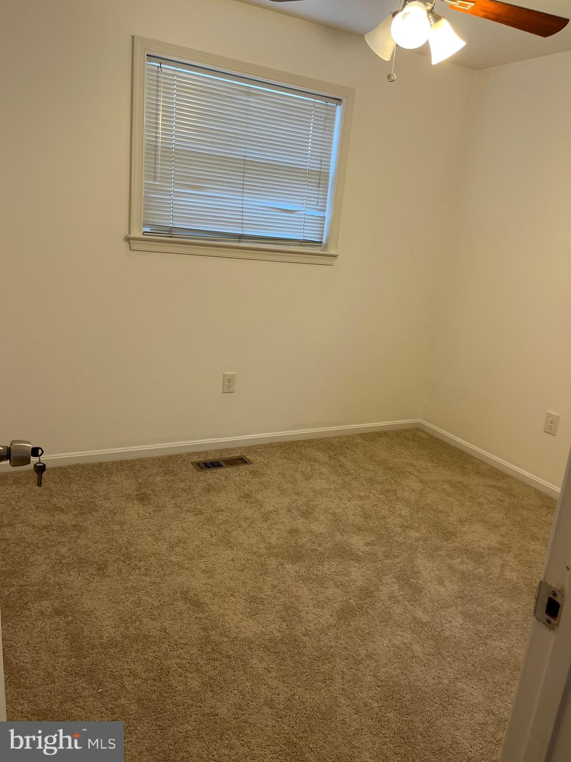 8829 Sigrid Road Randallstown, MD 21133 - Photo 15 of 28 an empty room with a window