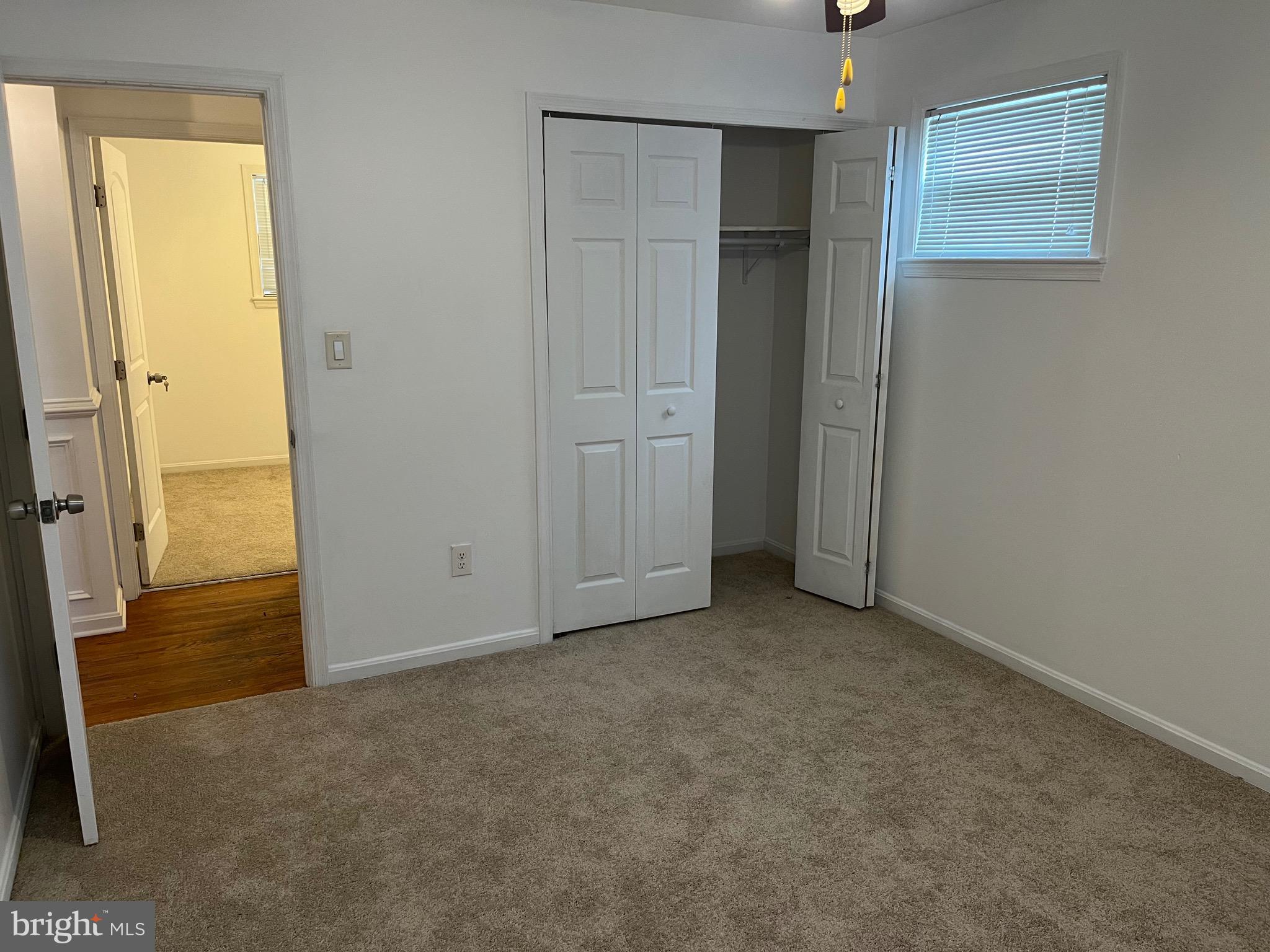 8829 Sigrid Road Randallstown, MD 21133 - Photo 17 of 28 an empty room with windows and closet
