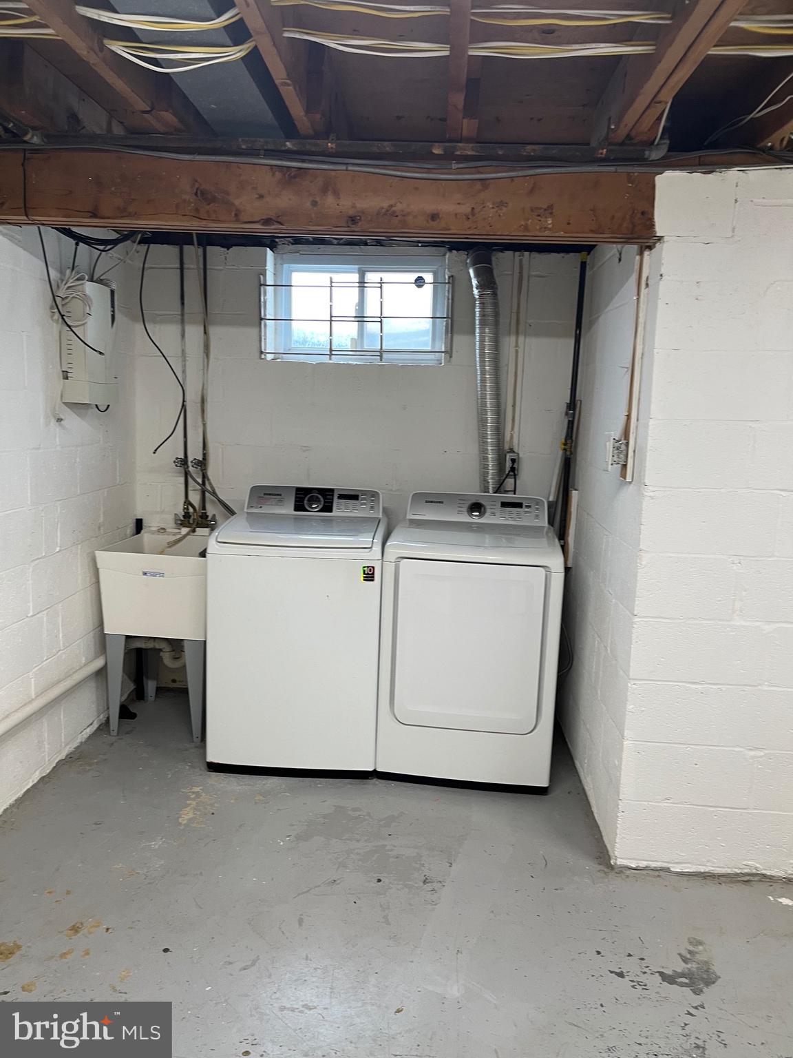 8829 Sigrid Road Randallstown, MD 21133 - Photo 19 of 28 a utility room with dryer and washer