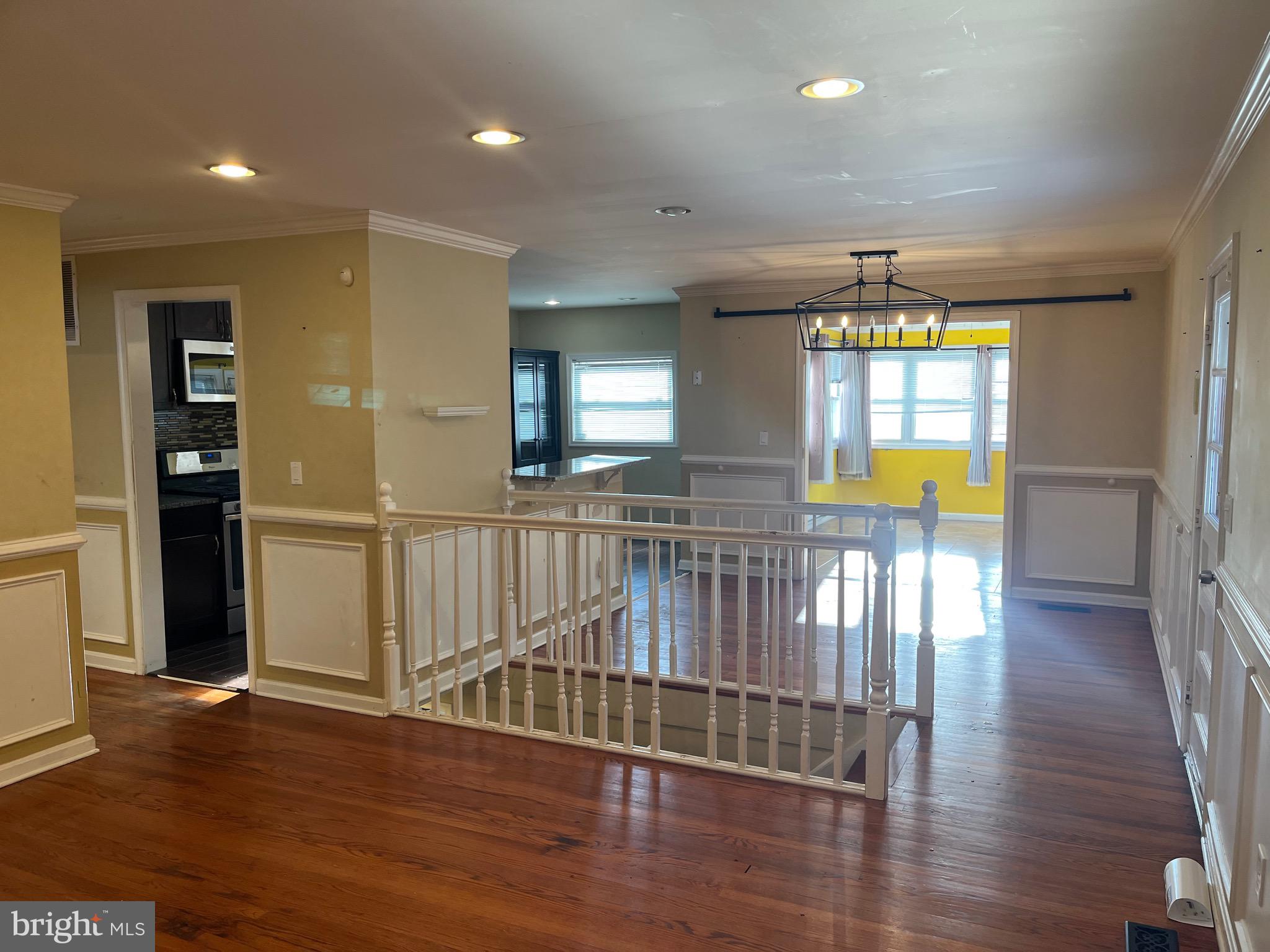 8829 Sigrid Road Randallstown, MD 21133 - Photo 2 of 23 an entryway in a hall with a window and wooden floor
