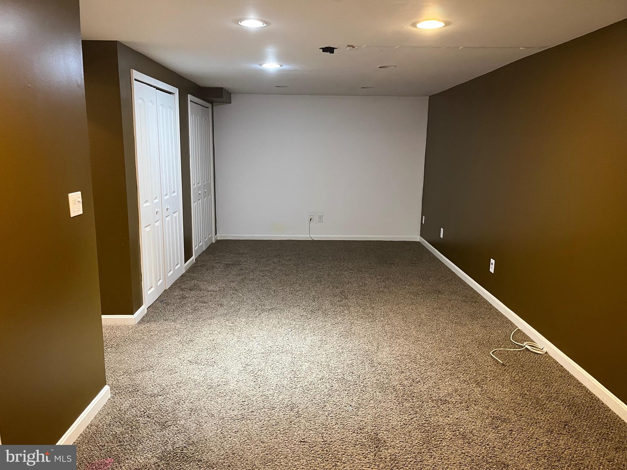 8829 Sigrid Road Randallstown, MD 21133 - Photo 23 of 28 an empty room with windows