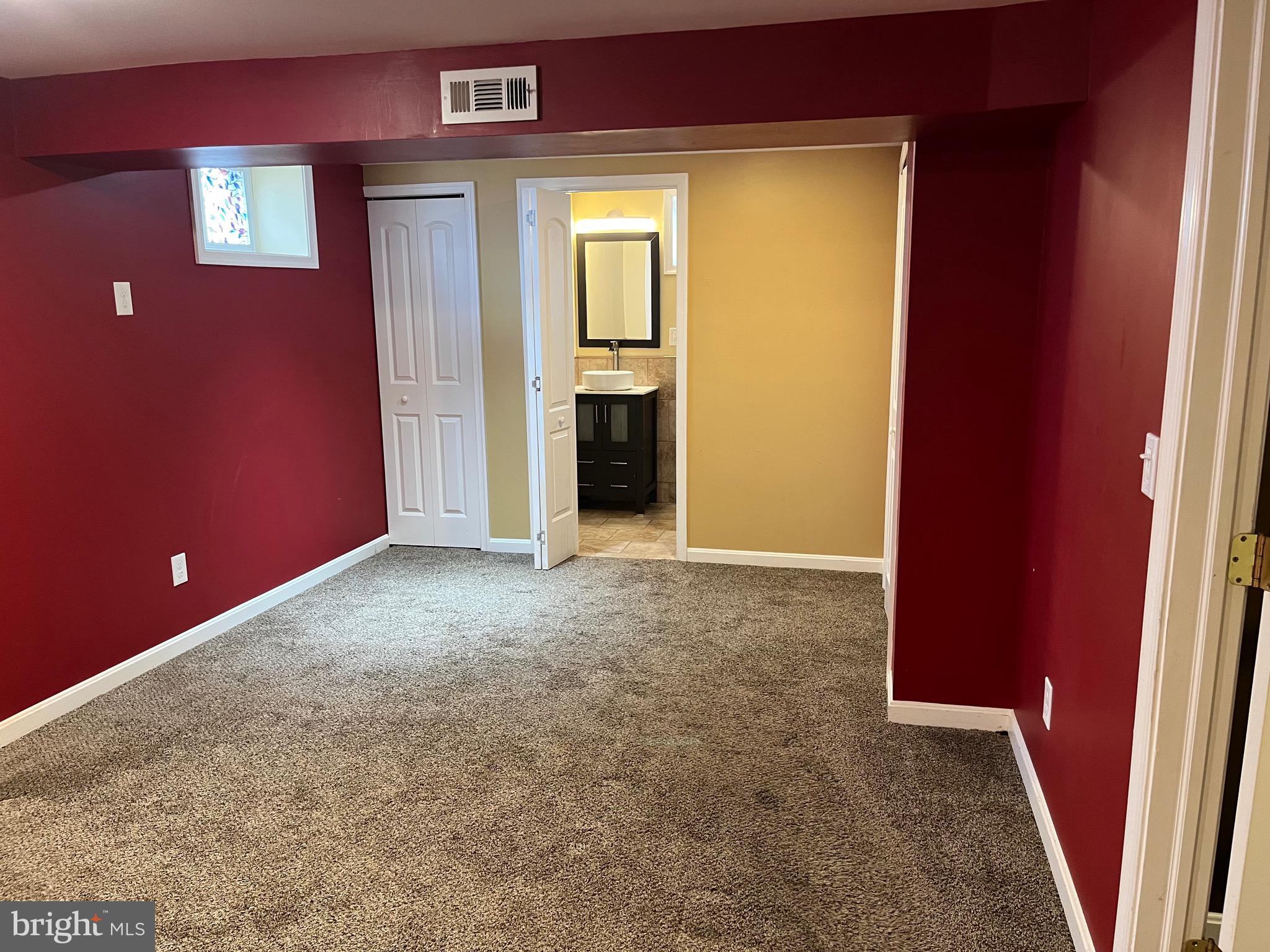 8829 Sigrid Road Randallstown, MD 21133 - Photo 25 of 28 a view of an empty room with a cabinet and a window
