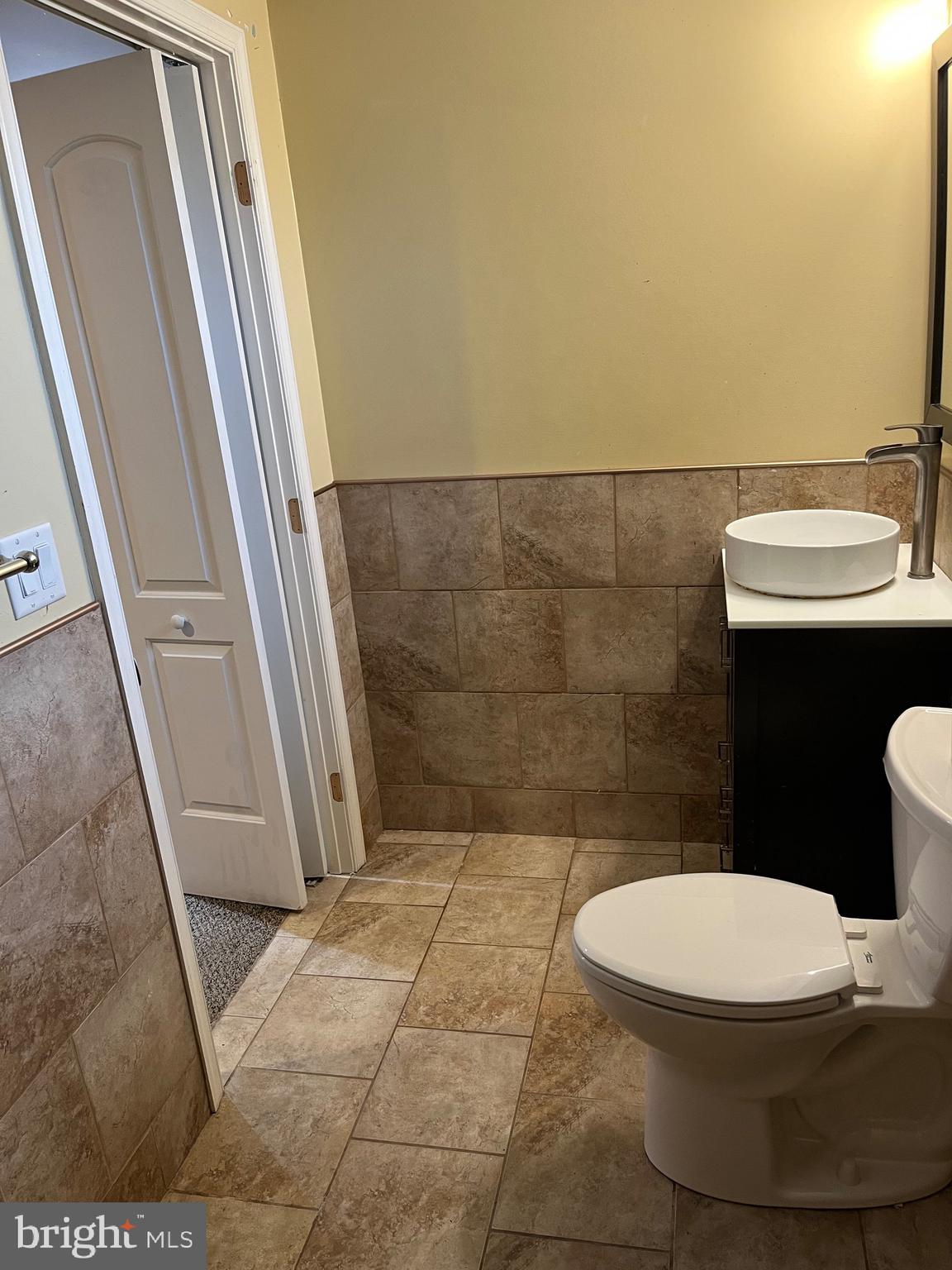 8829 Sigrid Road Randallstown, MD 21133 - Photo 28 of 28 a bathroom with a toilet and a sink