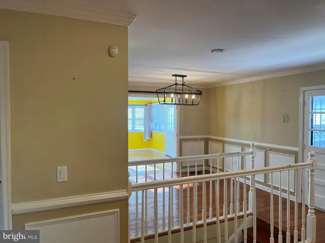 a view of entryway with a door and wooden floor